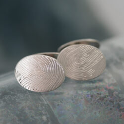 Manchetknopen met vingerafdrukken