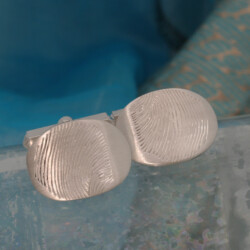 Zilveren manchetknopen met vingerafdrukken