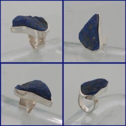 Een glanzende zilveren ring met ongeslepen lapis lazuli, de steen is 35 x 24 mm